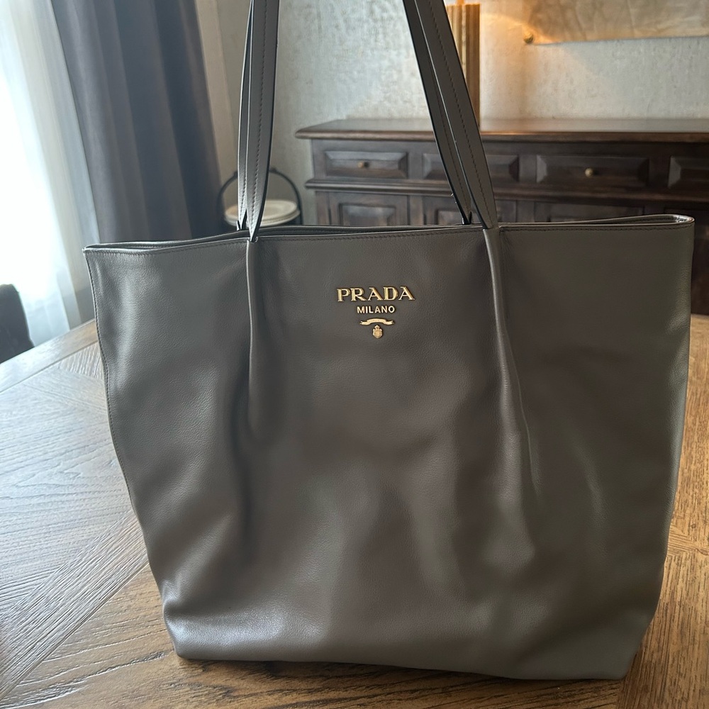 Prada purse grey with no worn no stains. Carried only a few times.